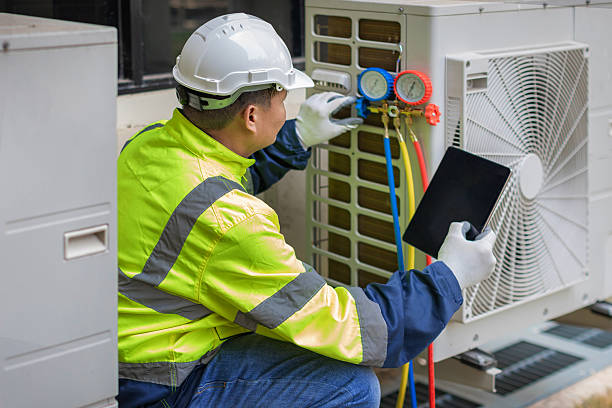 Professional Air Duct Cleaning technician working in Howell, MI